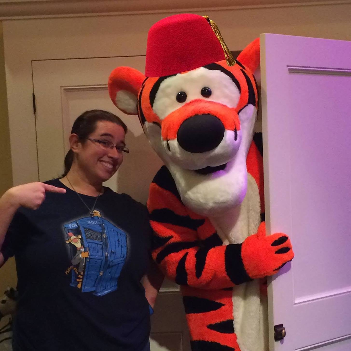 Ann Marie, Mascot Insider writer and journalist, posing with a mascot
